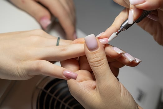 Female hands and tools for manicure, process of performing manicure photo