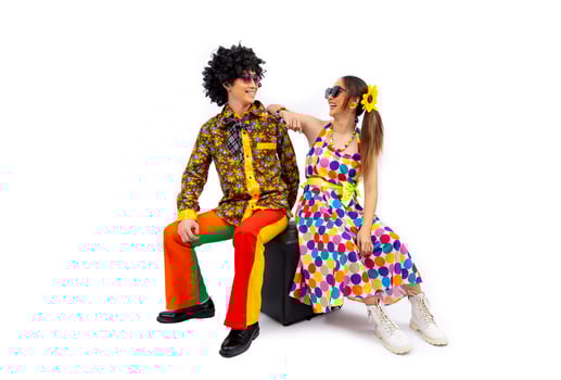 Asian hippie couple dress in 80s vintage dress fashion with colorful retro funk disco clothing while dancing isolated on white background for fancy outfit party and pop culture usage photo
