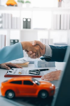 Insurance officers hand over the car keys after the tenant. have signed an auto insurance document or a lease or agreement document Buying or selling a new or used car with a car photo