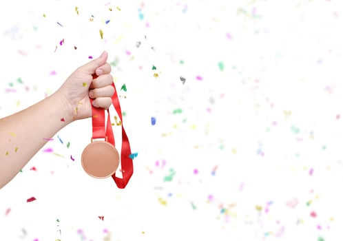 holding a bronze coin Celebrate success photo