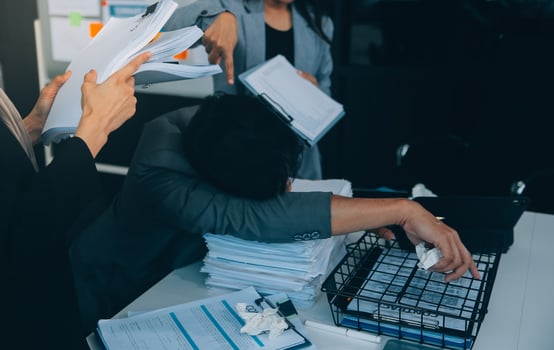 Stressful business man have so many paperwork in the office photo