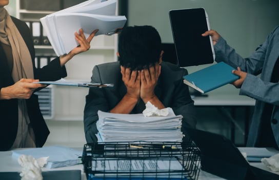 Stressful business man have so many paperwork in the office photo
