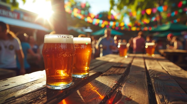 Three Glasses of Beer on a Wooden Table photo