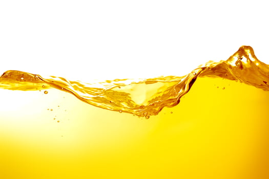 orange juice is isolated on white background. healthy fresh drink and natural waves. close up view. photo