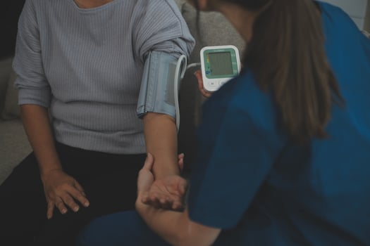 Doctor doing professional pressure examine her young patient photo