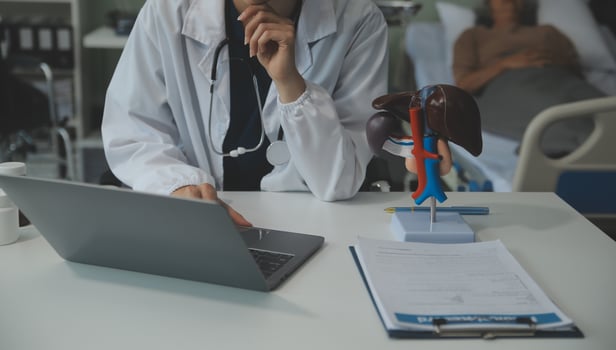 Female doctor explaining to patient results of model the process of patients. Diagnosis of diseases for Model Internal organ. photo