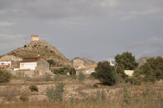 along the almanzora river, the village and on top of the mountain the santa barbara church photo