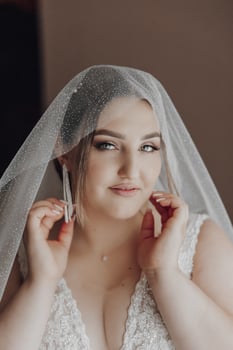 A woman is wearing a veil and is posing for a picture photo
