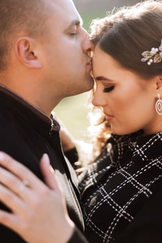 A man and woman are kissing each other photo