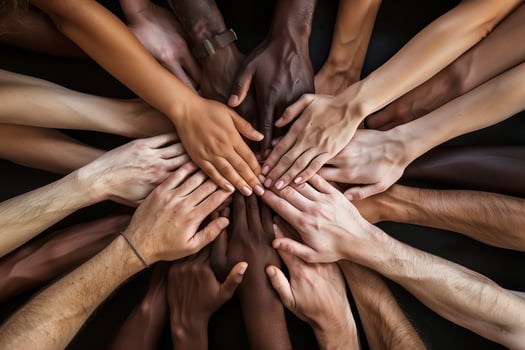 Hands of various races and ethnicities come together against discrimination. . photo