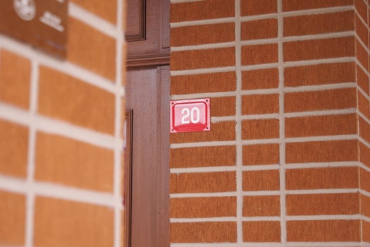 house number. Decorative lettering on a brick wall. photo