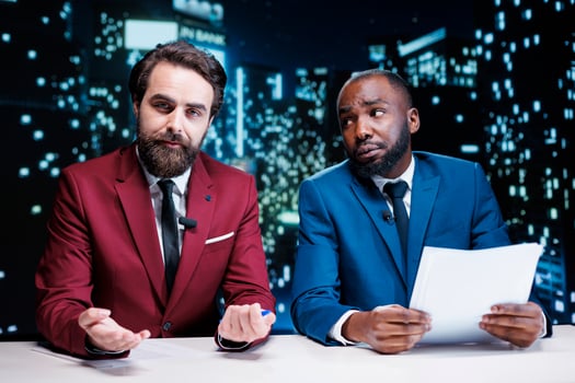 Team of presenters addressing latest news and events from around the world, discussing about newscast information regarding public interest matters. Diverse journalists night show hosts on tv. photo