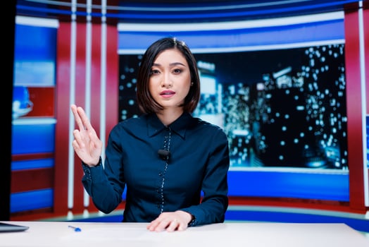 Presenter covering all breaking news topics and latest events occuring internationally, talking about issues in daily newscast reportage. Newscaster addressing celebrity drama in studio. photo