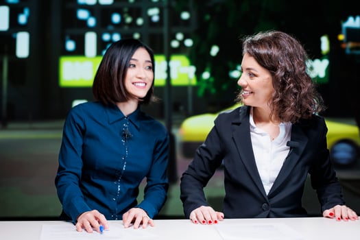 Reporters team on late night show in newsroom, presenting important topics information with exclusive details. Diverse journalists addressing celebrity gossip on tv live broadcast. photo