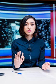 Reporter on night talk show presenting events during entertainment and media segment in newsroom. Woman journalist discussing about breaking news reportage with exclusive headlines. photo