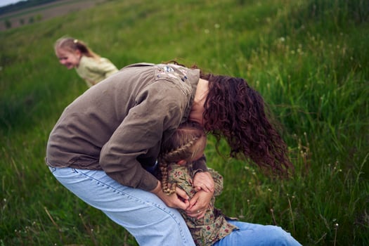 mother plays catch up with her daughters photo