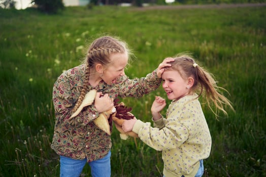 sisters fight over a toy bunny photo