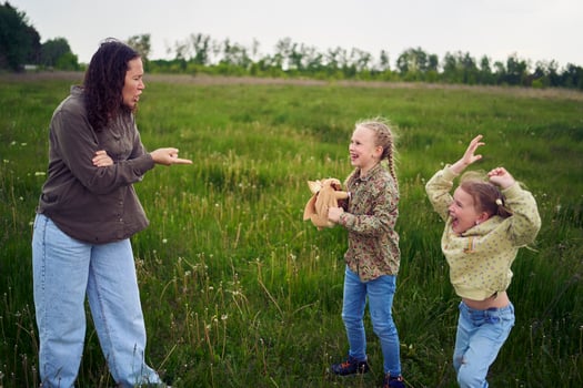 sisters fight over a toy bunny, mother quarrels photo