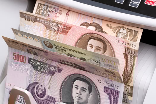 North Korean Won in a counting machine photo