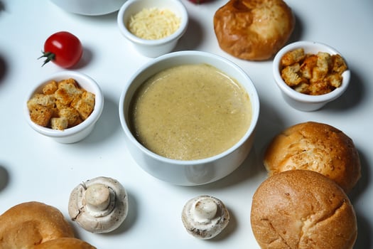 Table With Assorted Food Bowls and Muffins photo