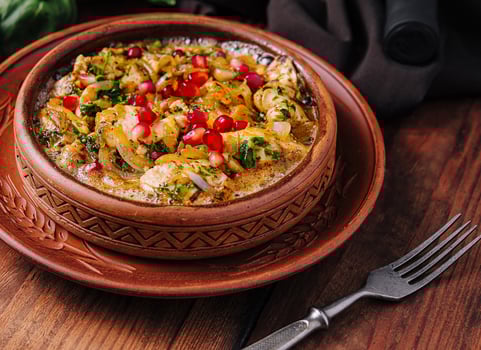 Savory shrimp hummus plate with pomegranate photo
