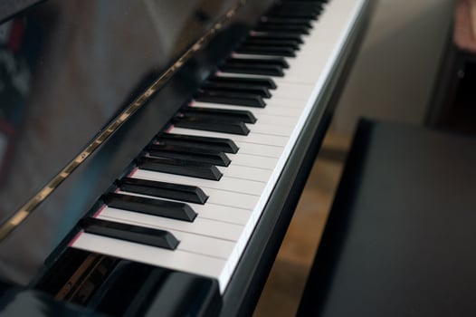 Classical piano keyboard with seat photo