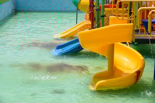 Yellow slider childhood of amusement waterpark photo