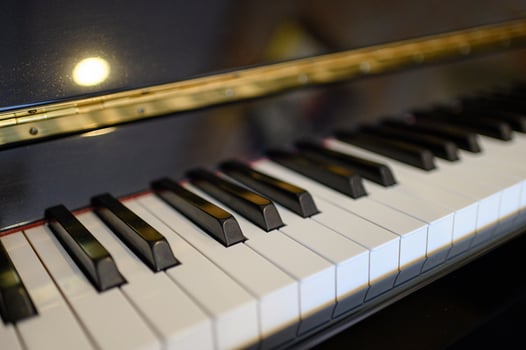 Piano keyboard instrument with shining background. selective focus photo