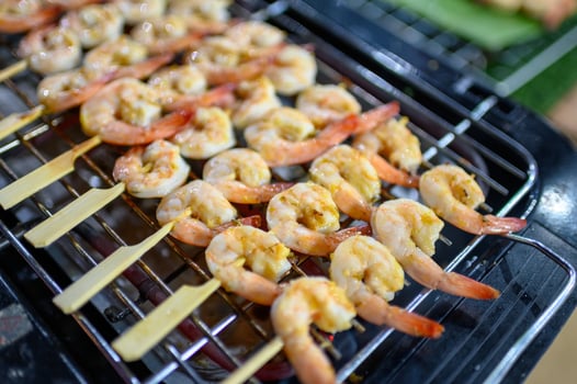 Grilled butter shrimps skewer in stick photo