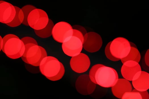 colorful and defocused lights on black background photo