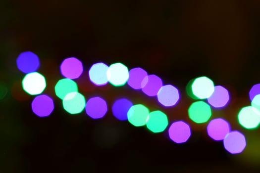 colorful and defocused lights on black background photo