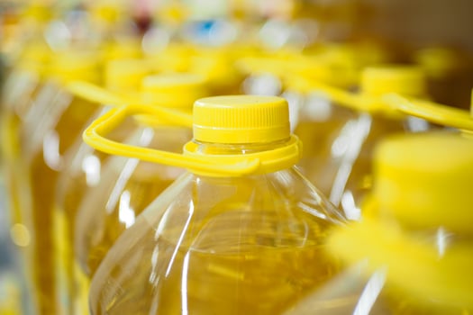 yellow sunflower oil bottle lined up in a store photo