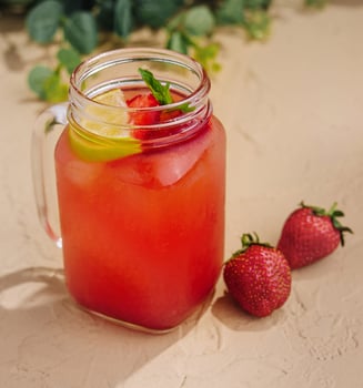 Refreshing strawberry lemonade in mason jar photo