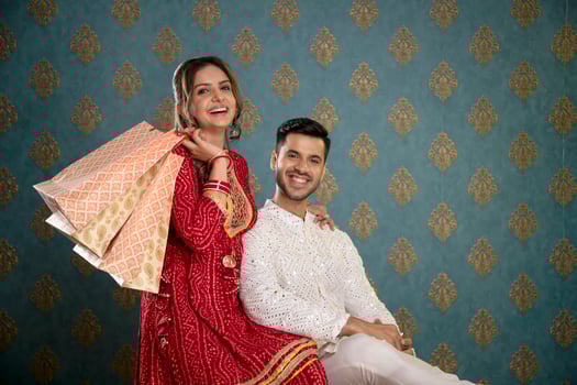 An Image Of A Romantic, Lovely Couple In Front Of The Camera Holding Shopping Bags photo