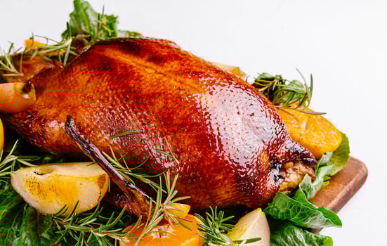 Succulent roast duck with citrus and herbs photo