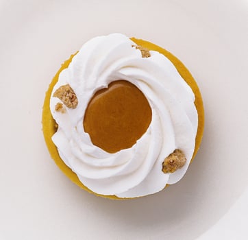 Delectable lemon tart with meringue on white plate photo