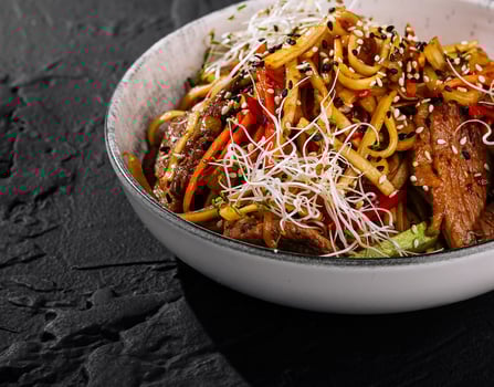 Asian beef stir fry with noodles and vegetables photo