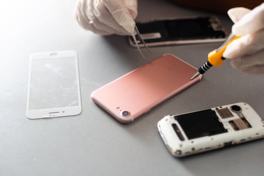 Close-up photos showing process of mobile phone repair