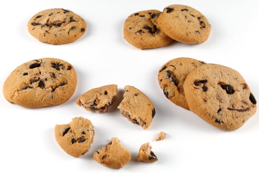 Cookies with pieces of chocolate on a white background photo
