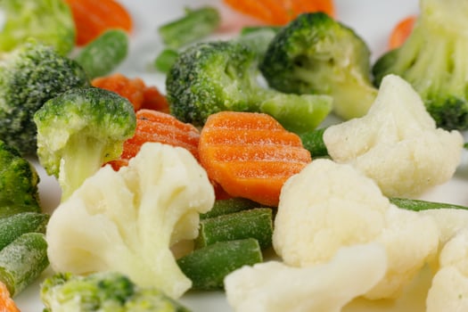 Frozen vegetables close-up on a white background. photo