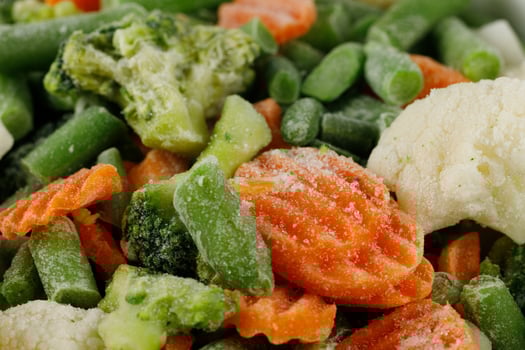 Frozen vegetables close-up. Vegetables in the fridge photo