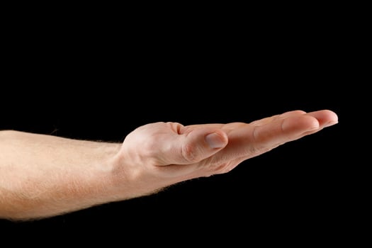 Hand and open palm on black isolate. Caucasian male hand. photo