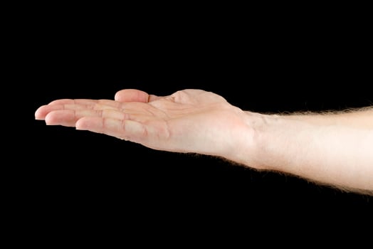 Hand and open palm on black isolate. Caucasian male hand. photo