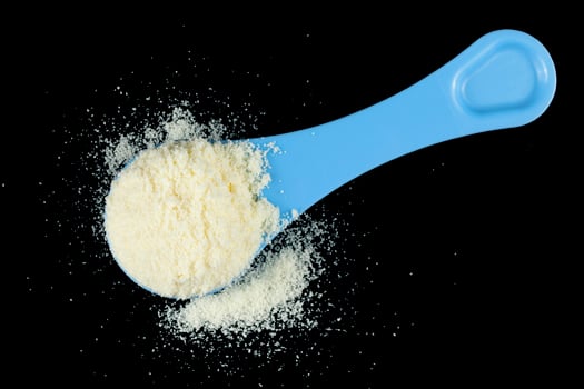 Yellow baby food powder in a pile. photo