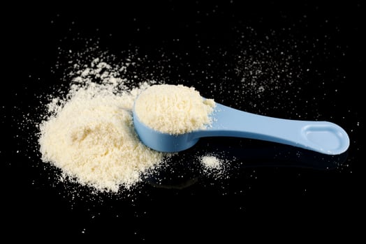 Yellow baby food powder in a pile. photo