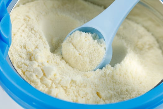 Sports nutrition in a jar. Protein powder. Whey protein powder in measuring scoop and jar photo