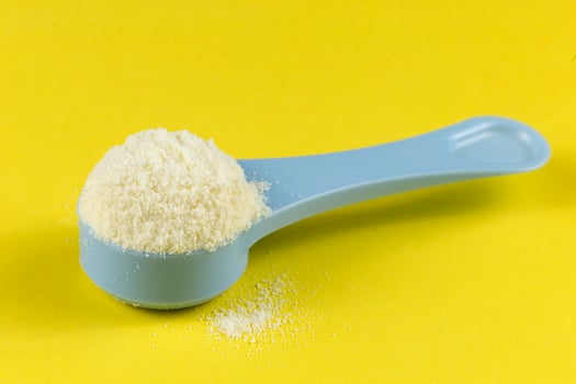 Sports nutrition in a spoon. Wheat protein powder for athletes. photo