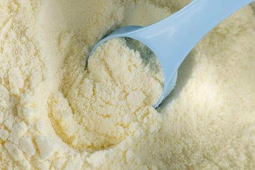 Yellow powder for children's nutrition in a jar. Sports nutrition - protein photo