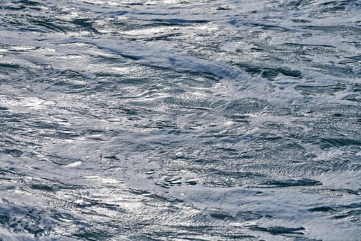 Dark foaming waves of stormy sea, background photo