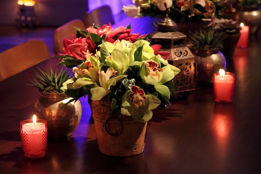 sophisticated party decoration with candles, flowers, tables and specialized lighting photo